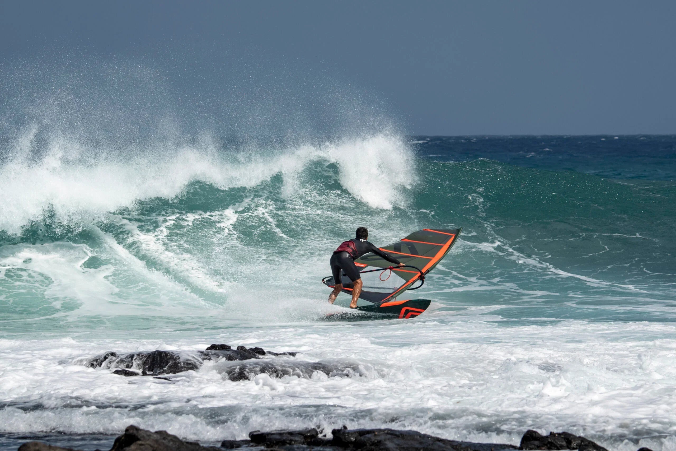 Image of a person wave sailing on a 2026 Severne Blade Windsurfing Sail, Available online at Surf Doctor