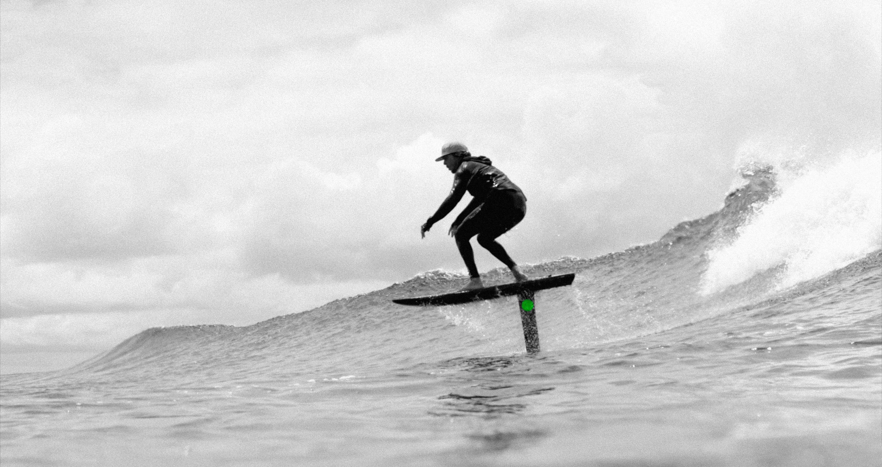 Person on a FliteLAB Amp eFoil Board surfing with a hydrofoil in the water