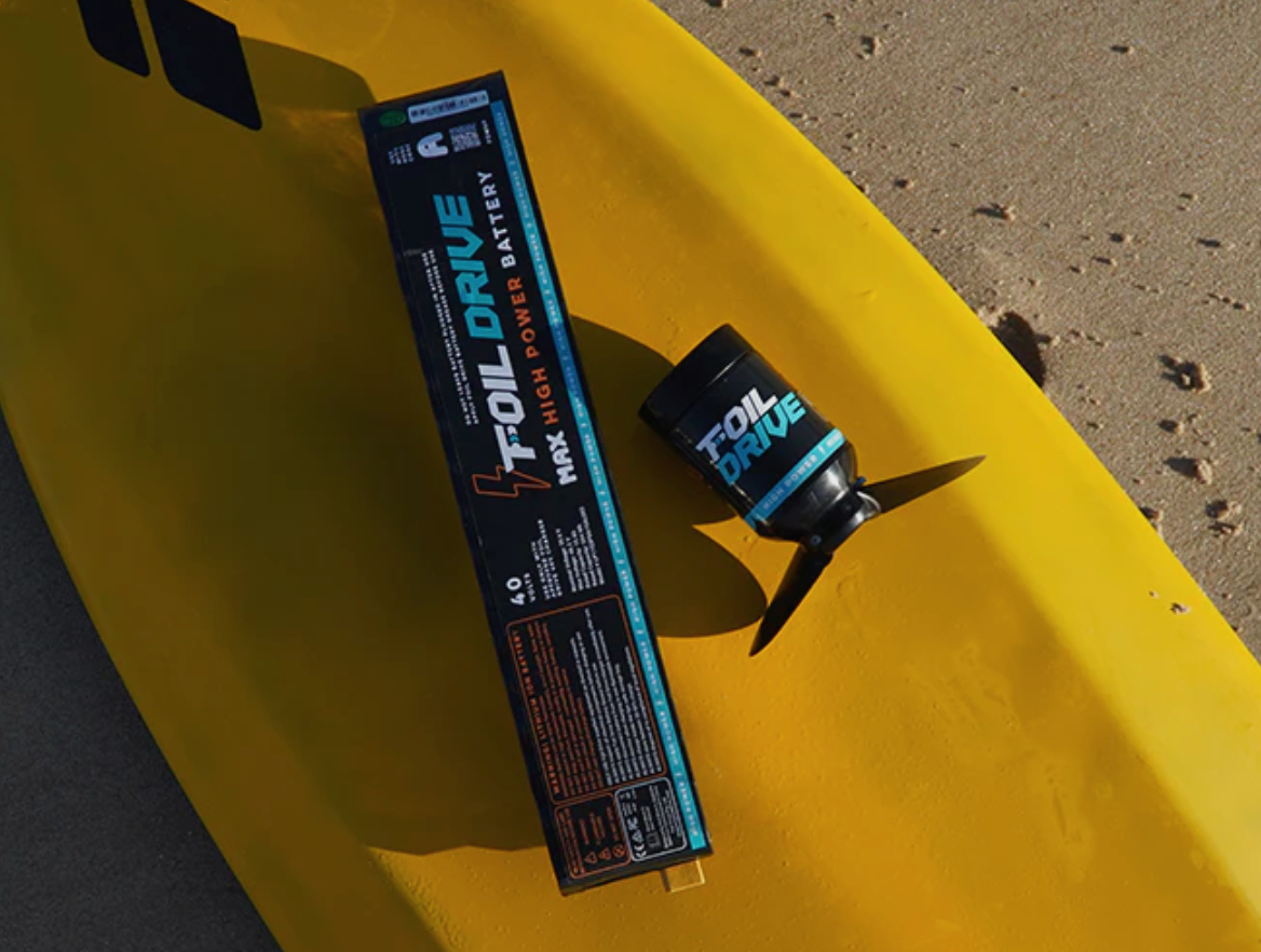 Image of a Foil Drive Max Assist eFoil on a yellow foil board