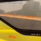 Close-up of a yellow and black windsurf sail with 'Goya' branding.