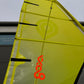 Yellow windsurf Sail with a Surfdoctor logo on a building