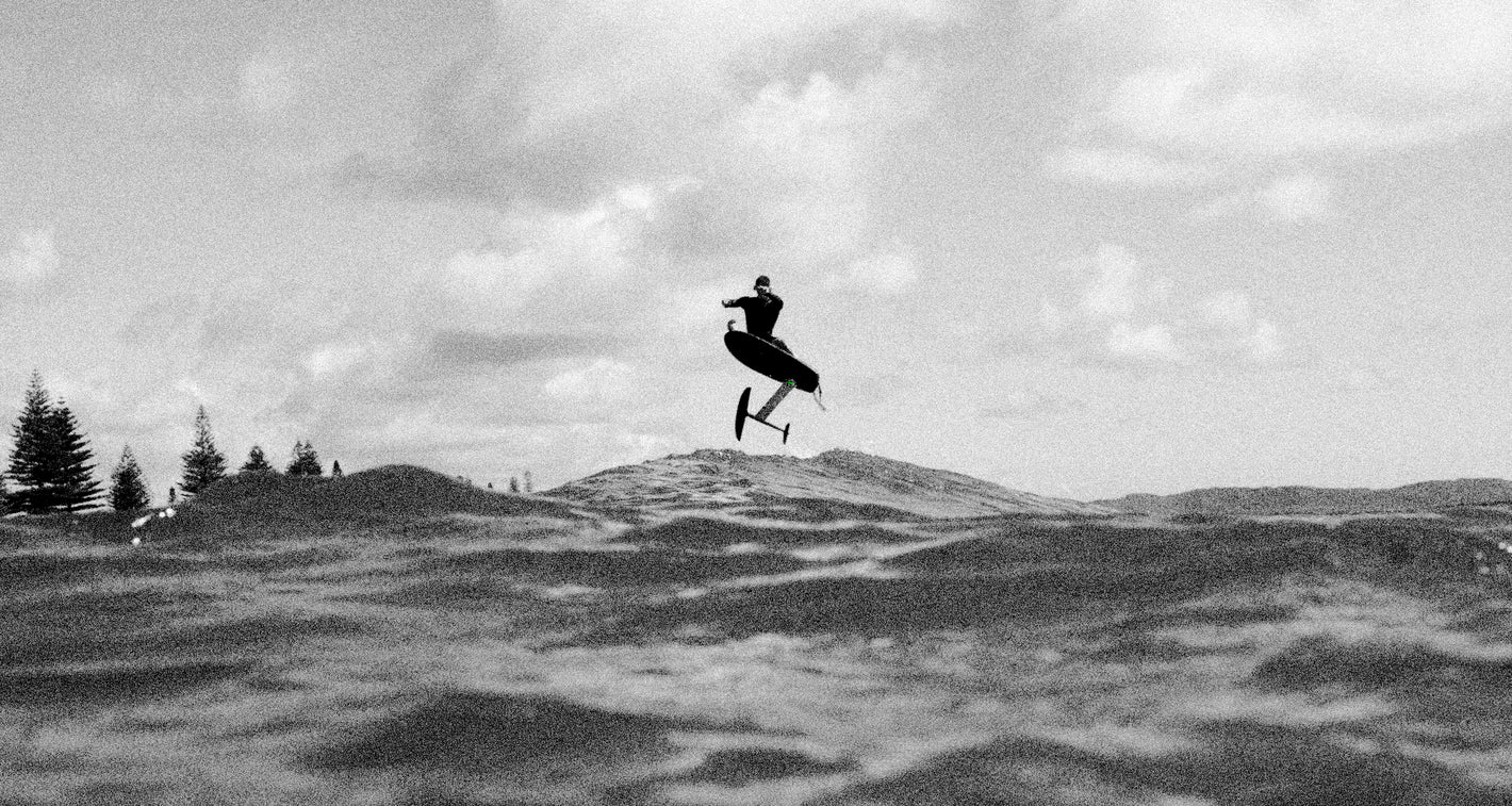  A person efoiling on a flitelab board on a wave  