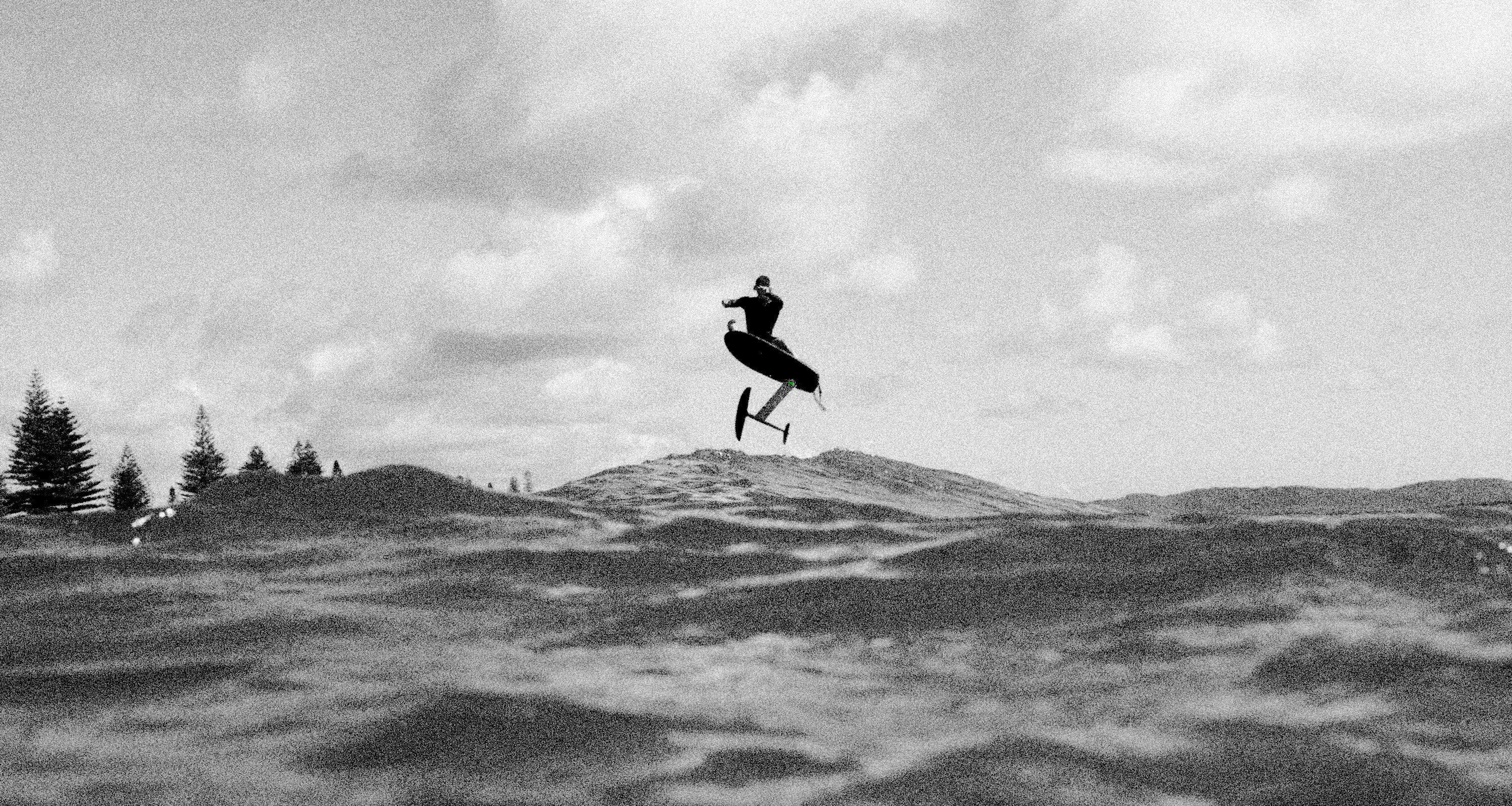  A person efoiling on a flitelab board on a wave  