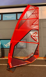 Red Severne Gator windsurf sail in front of  Surfdoctor Portland