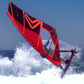 Person windsurfing on a Severne s1 Windsurfing Sail. A red sail against a clear blue sky.