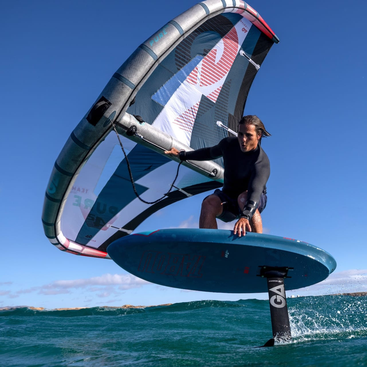 An image of a man wing foiling on Tabou GA wing foiling equipment 